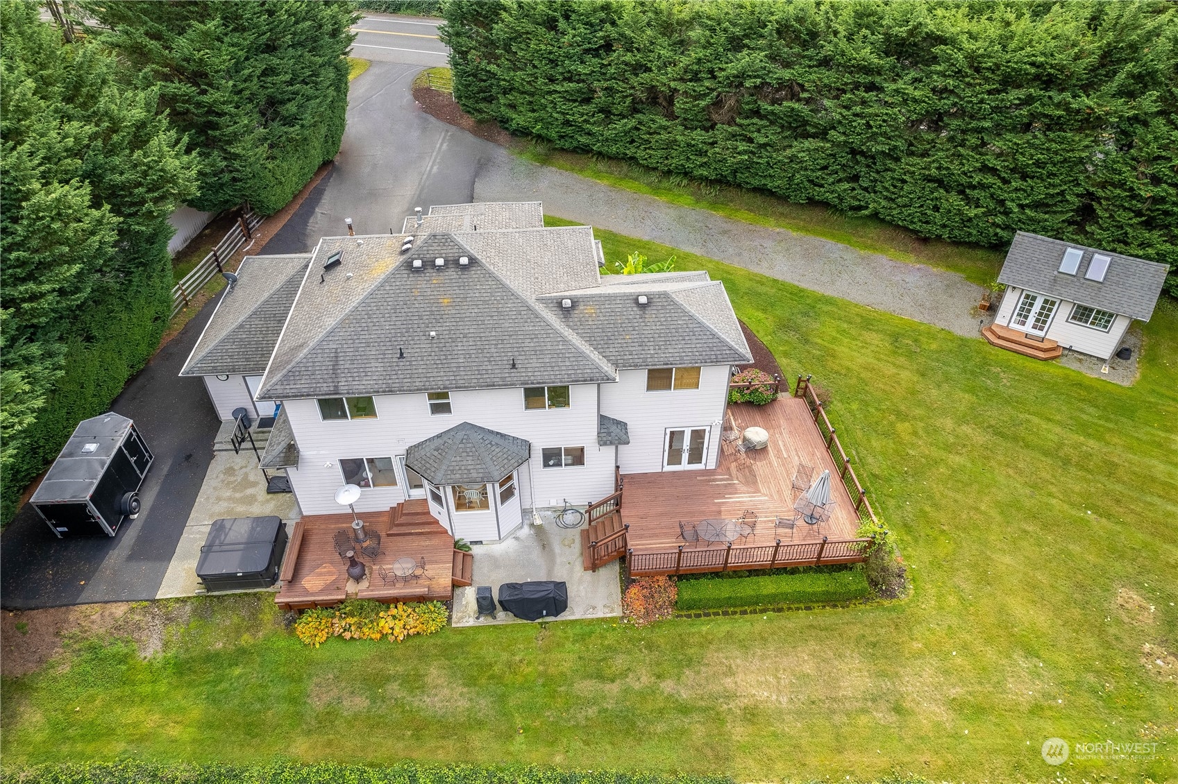 23408 Southeast 216th Way Maple Valley, WA 98038 - Photo 35 of 40 an aerial view of a house with swimming pool and garden