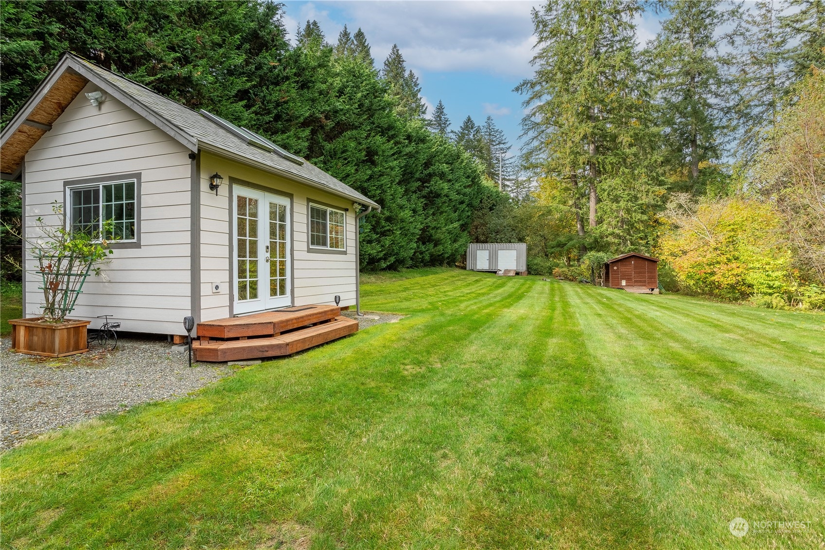 23408 Southeast 216th Way Maple Valley, WA 98038 - Photo 38 of 40 a view of a house with backyard and trees