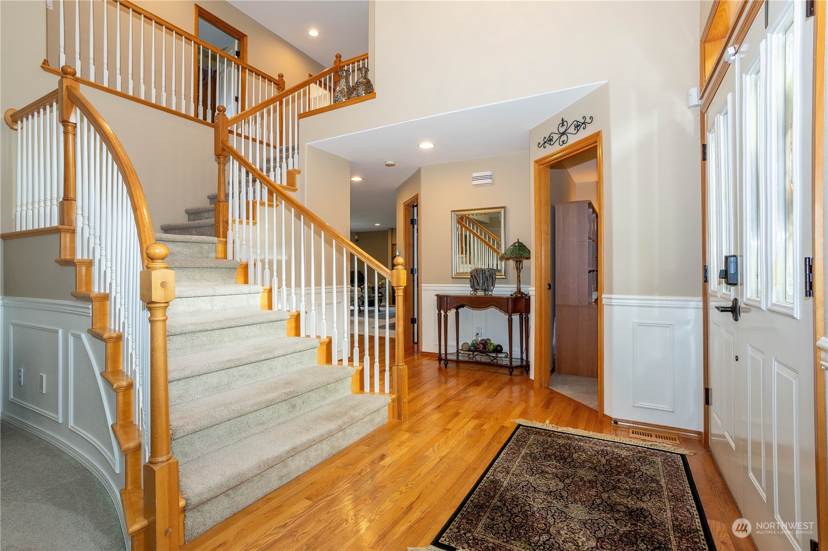 23408 Southeast 216th Way Maple Valley, WA 98038 - Photo 6 of 40 a view of entryway and hall with wooden floor