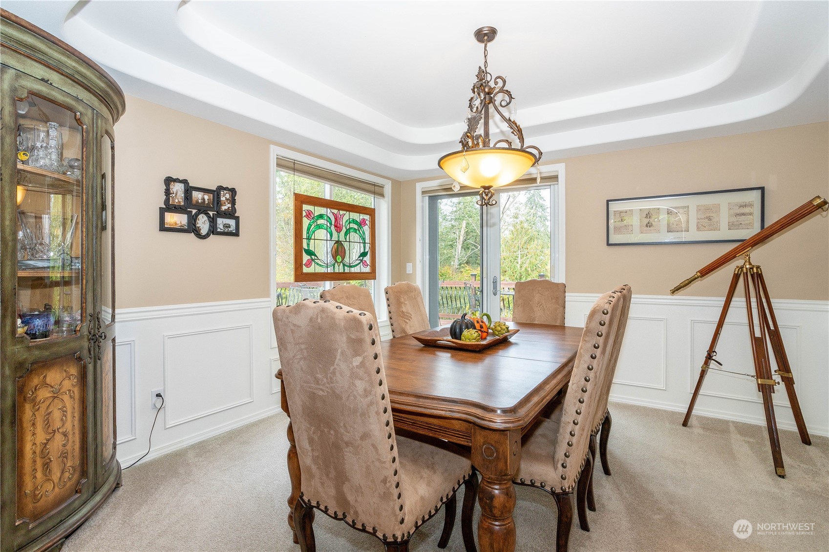 23408 Southeast 216th Way Maple Valley, WA 98038 - Photo 10 of 40 a view of a dining room with furniture window and wooden floor