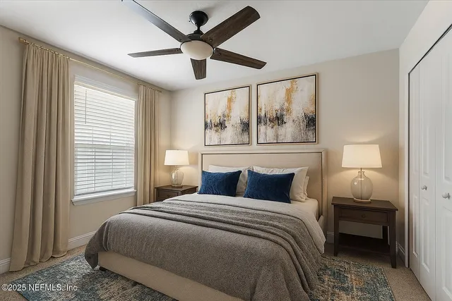 a bedroom with a large bed and a window