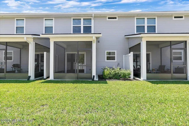 a view of house with yard and porch