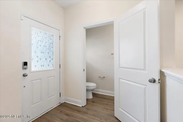 a bathroom with white walls