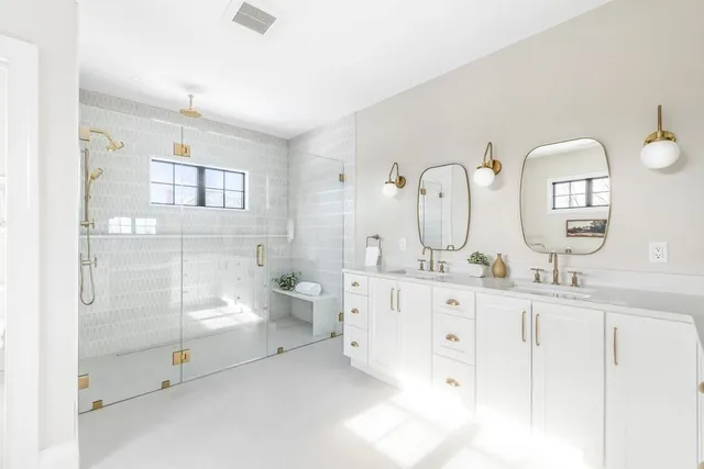 a bathroom with a bathtub and a shower