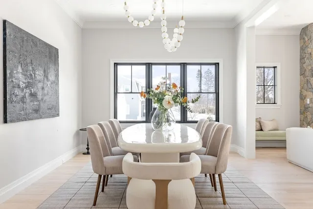 a view of a kitchen with a sink and dishwasher with wooden floor