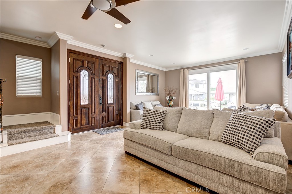 213 Baltimore Avenue Huntington Beach, CA 92648 - Photo 13 of 50 a living room with furniture and a large window
