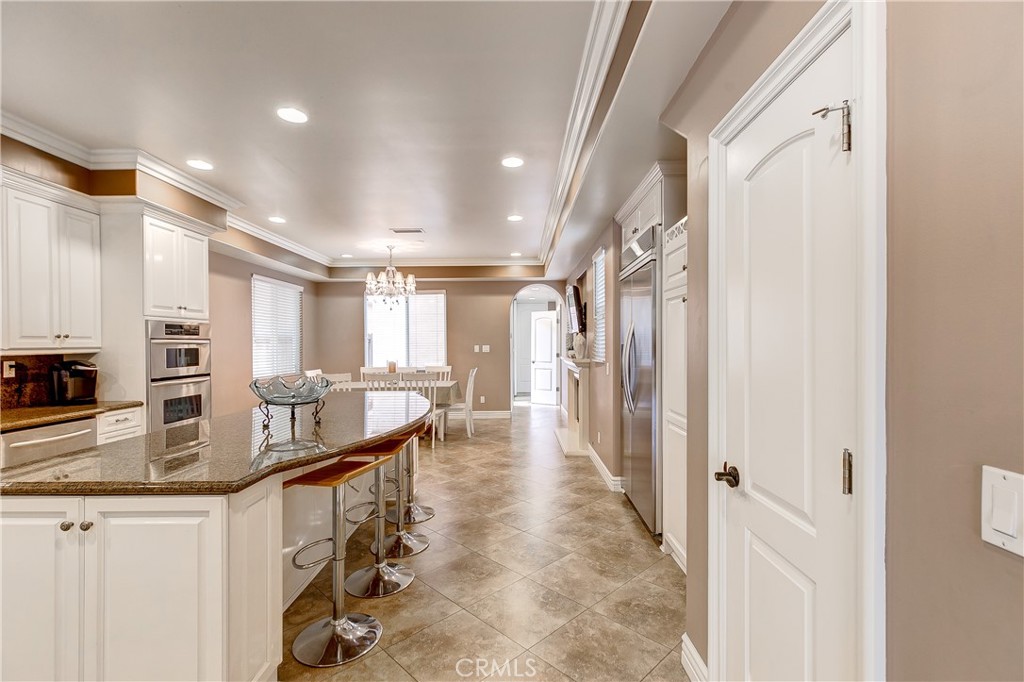 213 Baltimore Avenue Huntington Beach, CA 92648 - Photo 14 of 50 a kitchen with counter top space and stainless steel appliances
