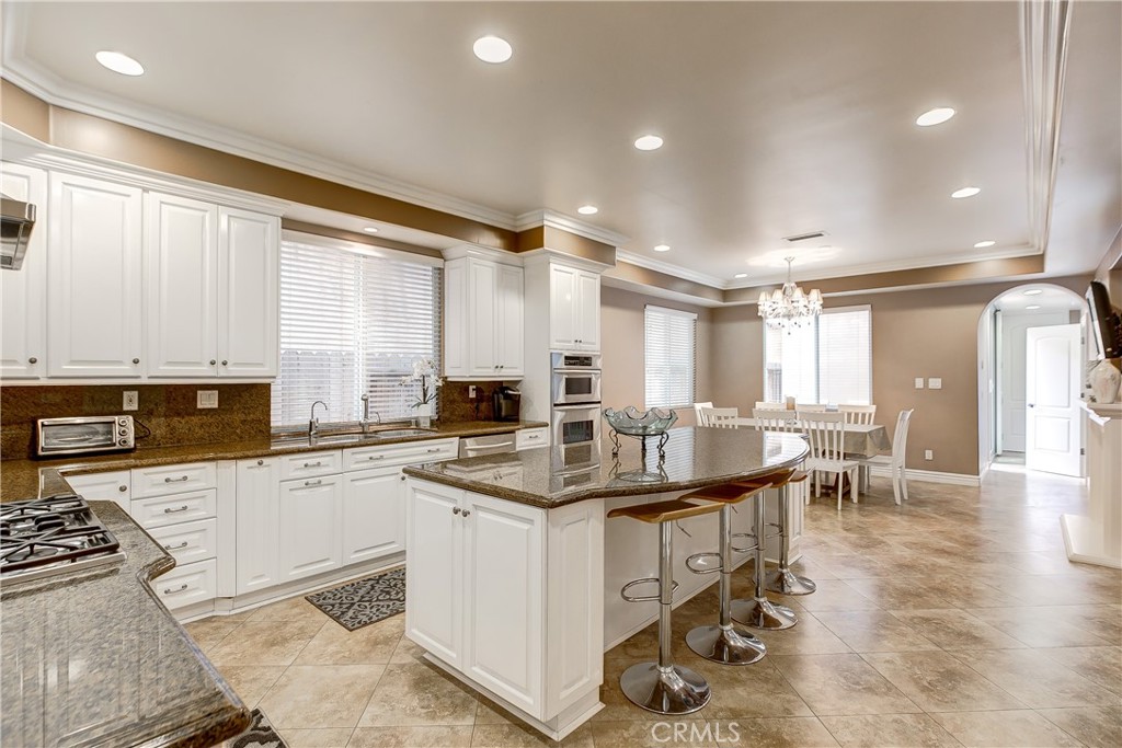 213 Baltimore Avenue Huntington Beach, CA 92648 - Photo 15 of 50 a kitchen with appliances a sink a counter top space and cabinets