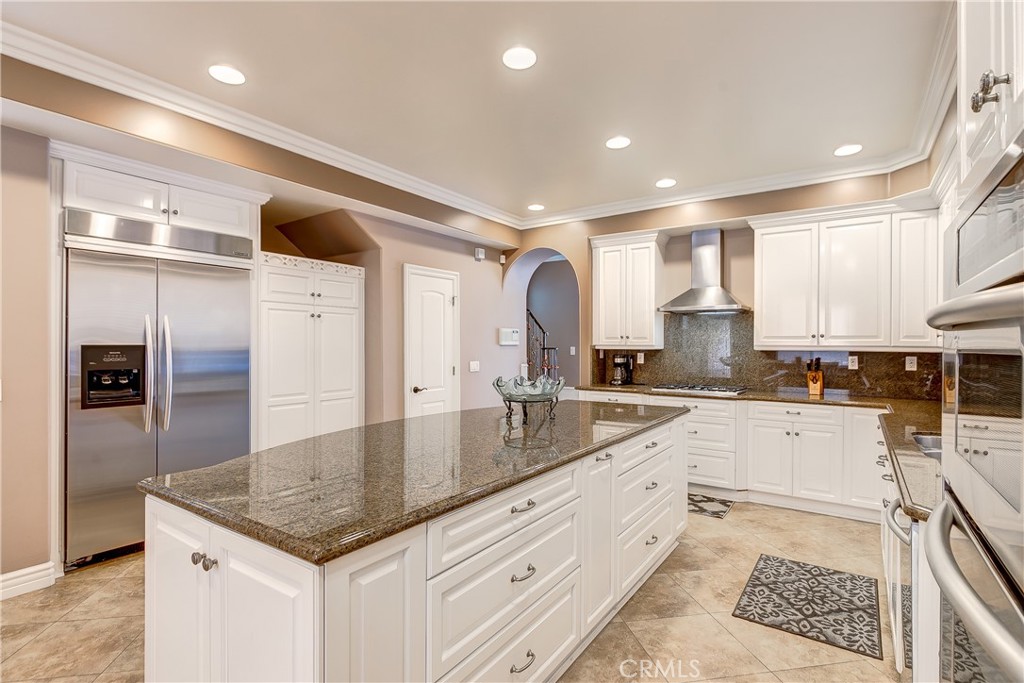 213 Baltimore Avenue Huntington Beach, CA 92648 - Photo 19 of 50 a kitchen with stainless steel appliances granite countertop a sink and cabinets