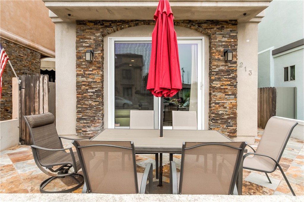 213 Baltimore Avenue Huntington Beach, CA 92648 - Photo 3 of 50 a balcony with furniture and a window