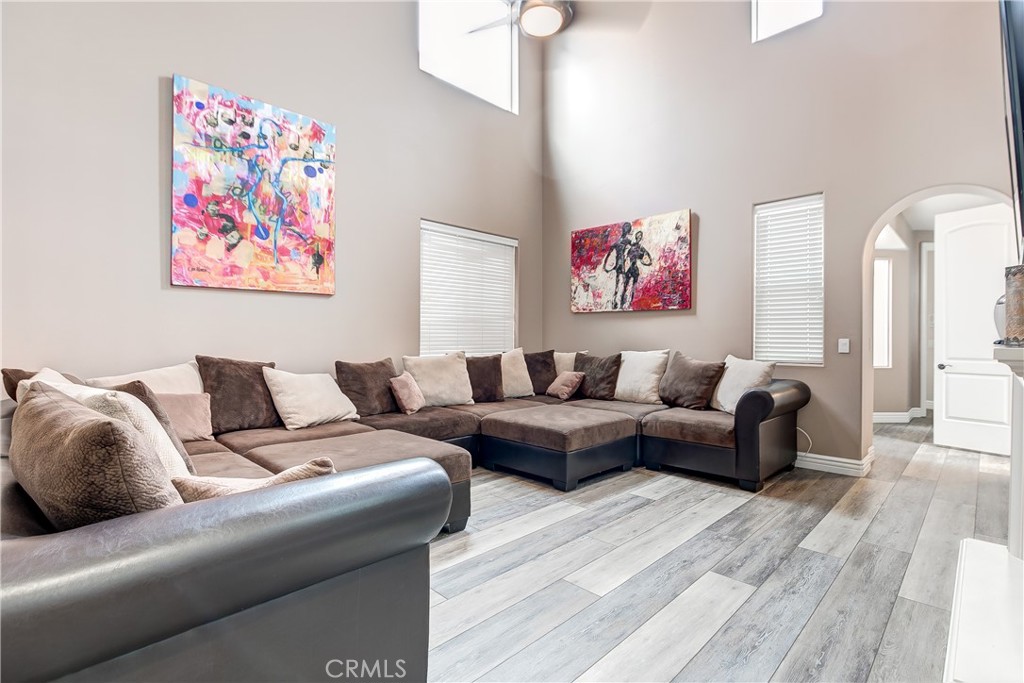 213 Baltimore Avenue Huntington Beach, CA 92648 - Photo 31 of 50 a living room with furniture and a wooden floor