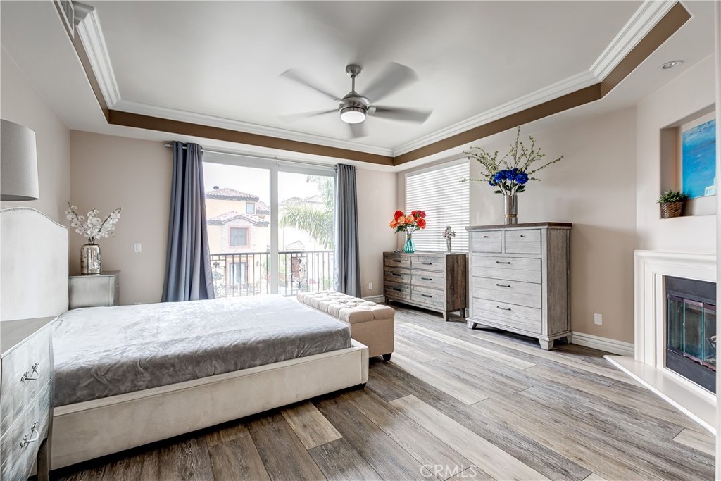 213 Baltimore Avenue Huntington Beach, CA 92648 - Photo 38 of 50 a bedroom with a bed and a chandelier