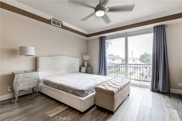 a bedroom with a large bed and a large window