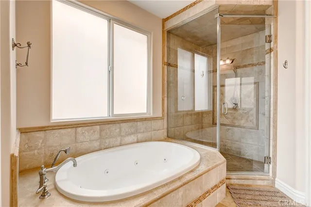 a bathroom with a bathtub and a shower