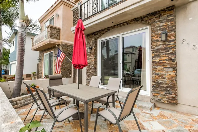 a view of a dinning tables and chairs in porch of a house