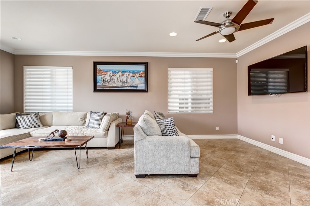 213 Baltimore Avenue Huntington Beach, CA 92648 - Photo 8 of 50 a living room with furniture and a flat screen tv