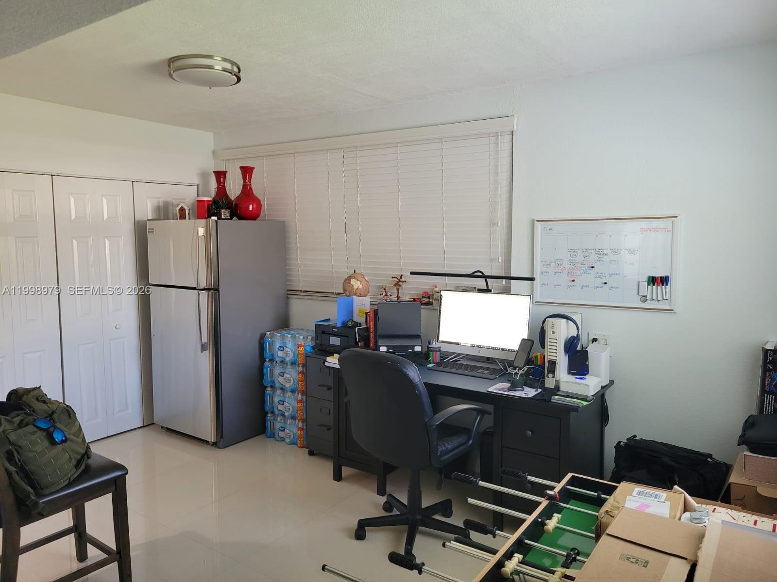 8245 Southwest 43rd Street Miami, FL 33155 - Photo 13 of 24 a view of workspace with wooden floor workspace