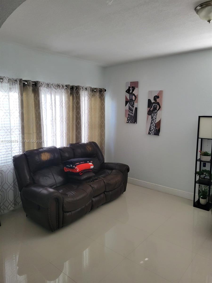 8245 Southwest 43rd Street Miami, FL 33155 - Photo 17 of 24 a living room with furniture and a window