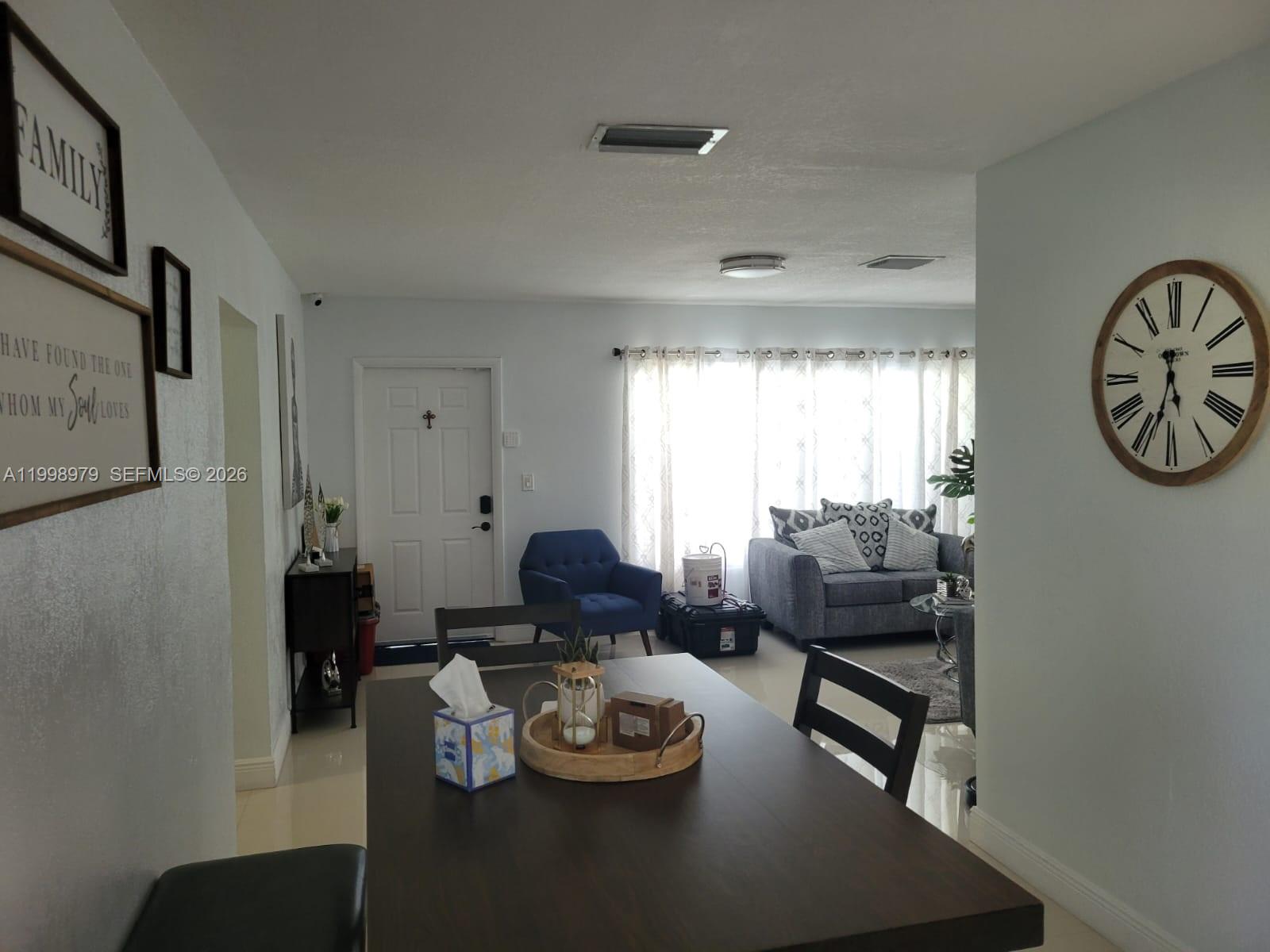 8245 Southwest 43rd Street Miami, FL 33155 - Photo 19 of 24 a living room with furniture and a window