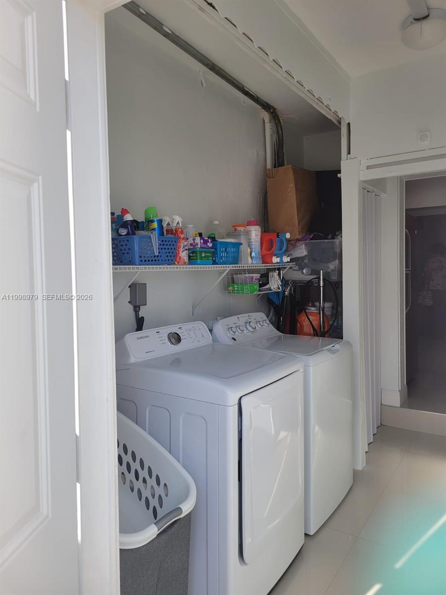 8245 Southwest 43rd Street Miami, FL 33155 - Photo 20 of 24 a utility room with dryer and washer