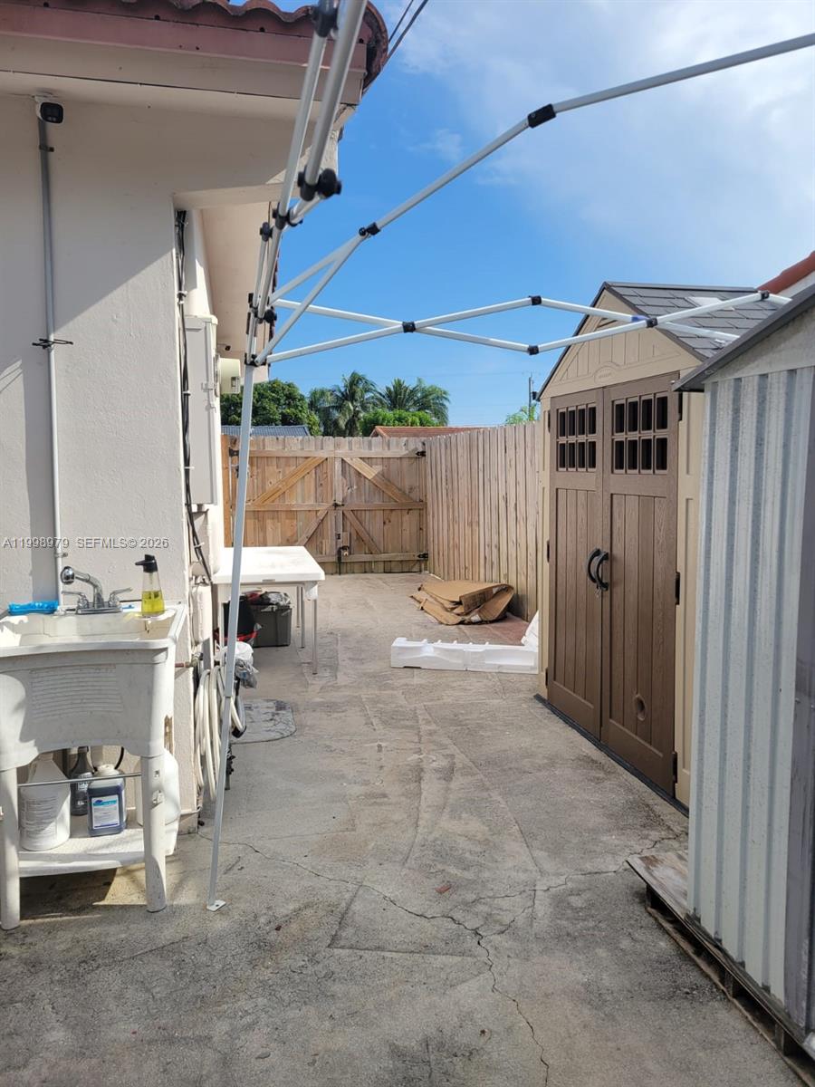 8245 Southwest 43rd Street Miami, FL 33155 - Photo 23 of 24 a view of a patio with table and chairs