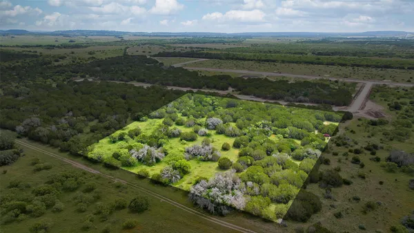 a view of a lake with a yard