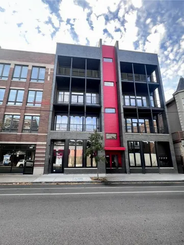 a view of a building with a street