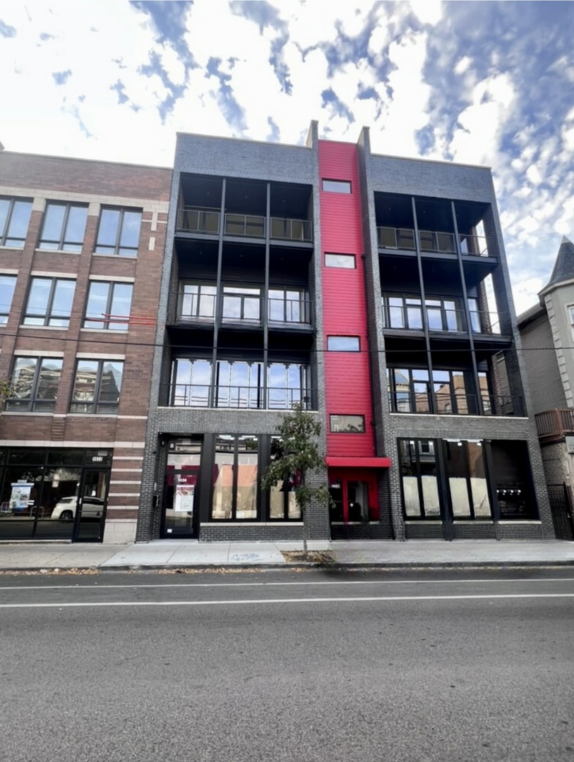 a view of a building with a street
