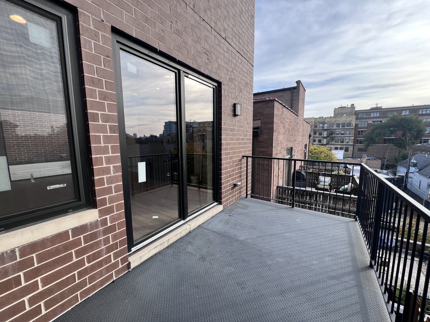 1039 West Belmont Avenue, Unit 4 Chicago, IL 60657 - Photo 17 of 22 a view of a balcony with chairs