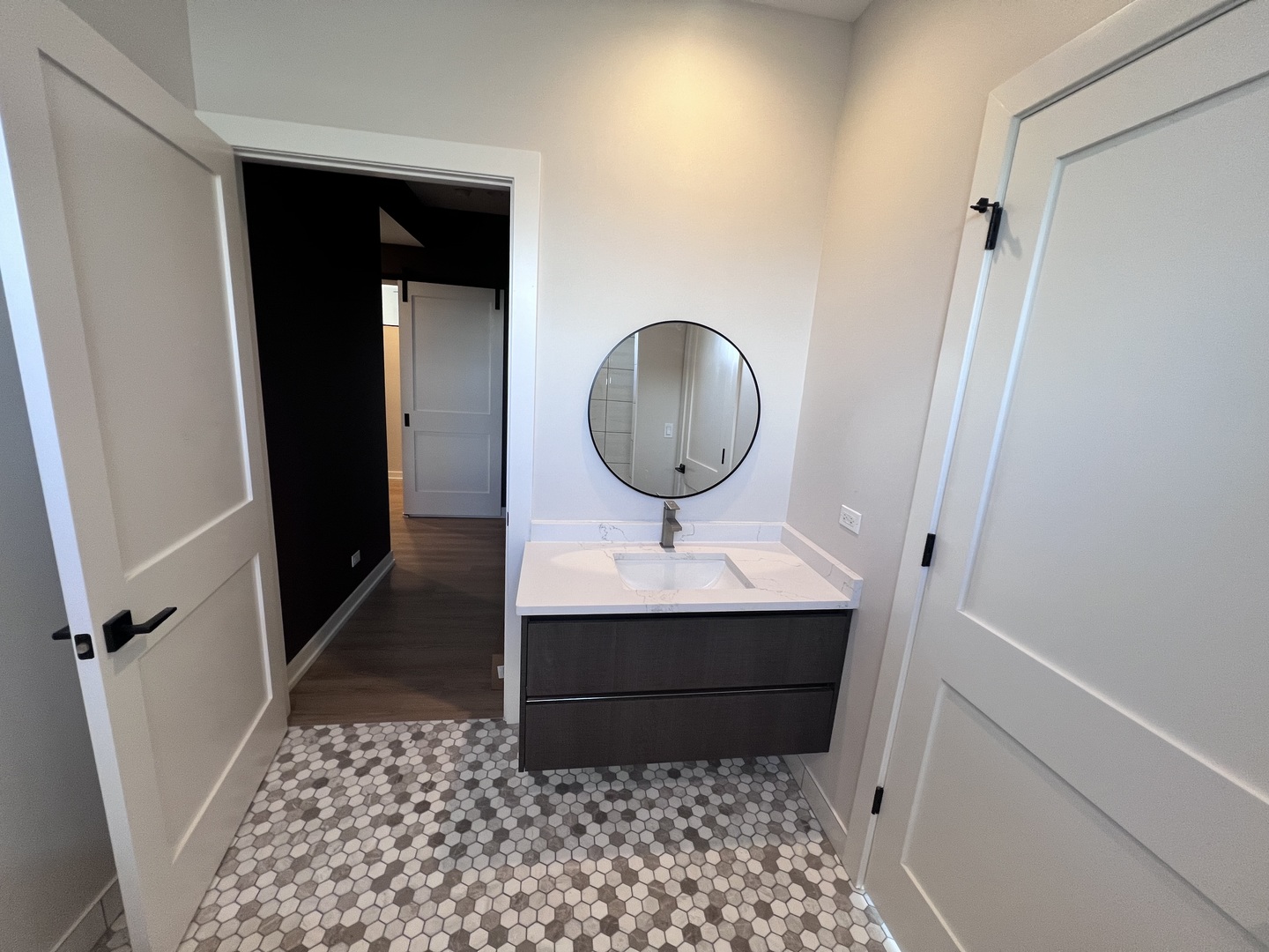 1039 West Belmont Avenue, Unit 4 Chicago, IL 60657 - Photo 18 of 22 a bathroom with a sink and a mirror