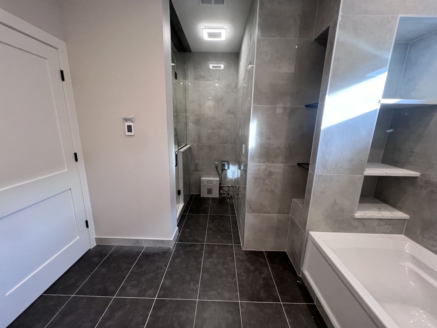 1039 West Belmont Avenue, Unit 4 Chicago, IL 60657 - Photo 10 of 22 a bathroom with a bathtub and a shower