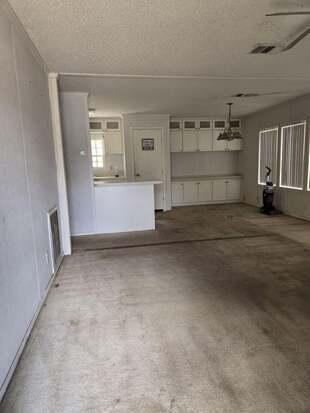 1155 Northeast 342nd Trail Okeechobee, FL 34972 - Photo 4 of 7 an empty room with windows