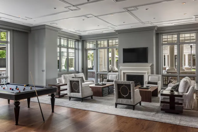 a living room with fireplace furniture and a flat screen tv