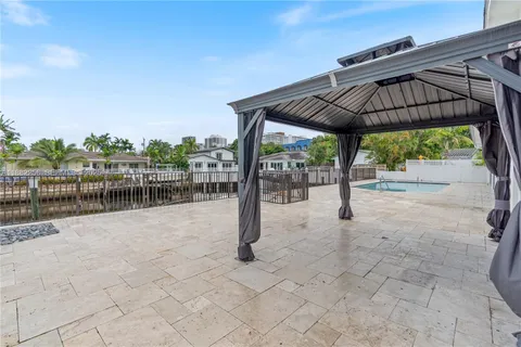 a view of a lake with furniture