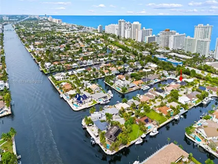 a front view of a house with a yard and fountain