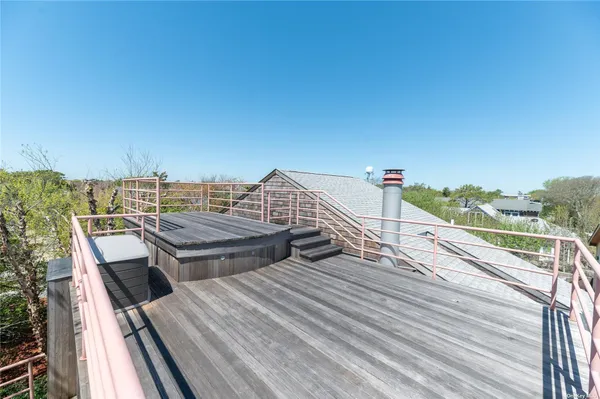 a view of roof deck with patio