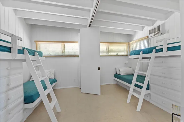 a view of room with furniture and windows