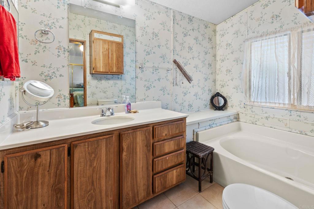 28890 Lilac Road, Unit 160 Valley Center, CA 92082 - Photo 12 of 30 a bathroom with a sink and a mirror