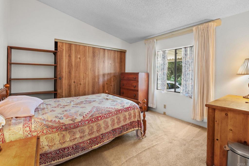 28890 Lilac Road, Unit 160 Valley Center, CA 92082 - Photo 18 of 30 a bedroom with a bed and a window
