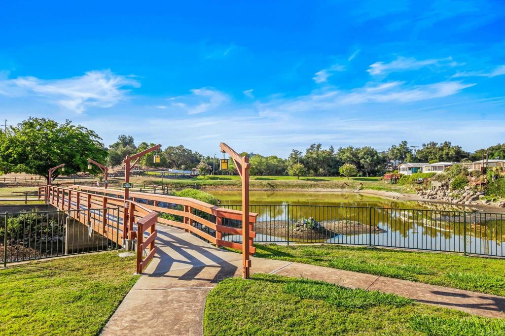 28890 Lilac Road, Unit 160 Valley Center, CA 92082 - Photo 27 of 30 a view of a lake with a yard