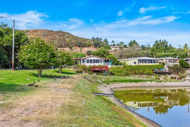 a view of a lake with a house in the background