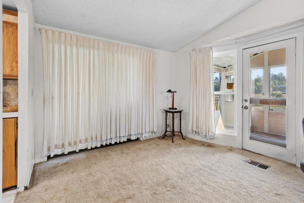 28890 Lilac Road, Unit 160 Valley Center, CA 92082 - Photo 10 of 30 an empty room with windows