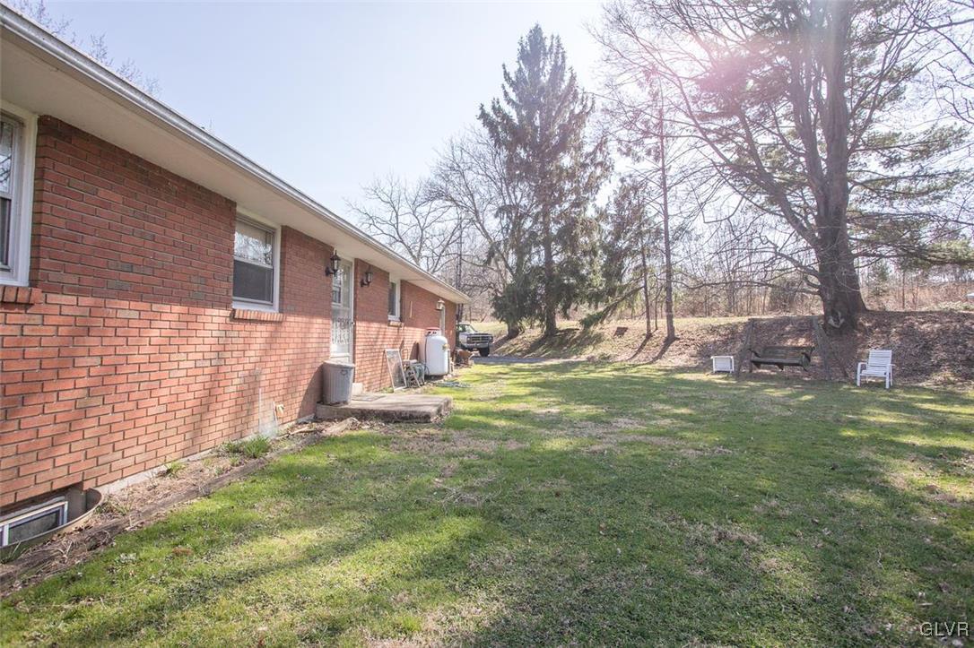 223 Grouse Drive Bath, PA 18014 - Photo 17 of 18 a view of a house with a yard and a tree