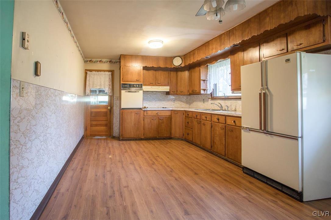 223 Grouse Drive Bath, PA 18014 - Photo 4 of 18 a kitchen with stainless steel appliances a refrigerator and wooden floor