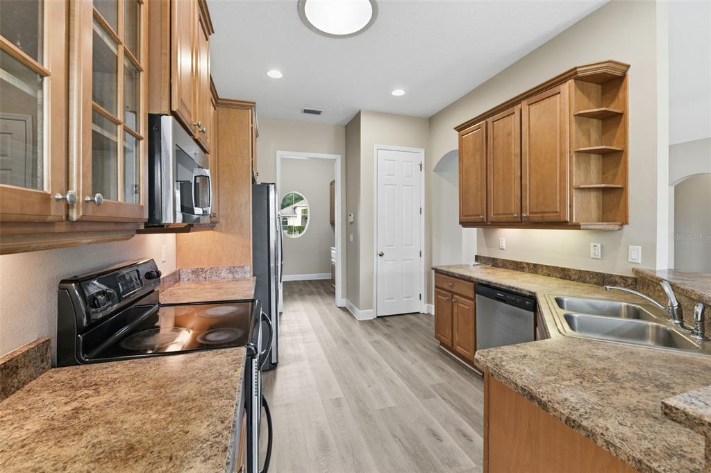 609 Renner Road Port Orange, FL 32127 - Photo 12 of 37 a kitchen with stainless steel appliances granite countertop a stove and a sink