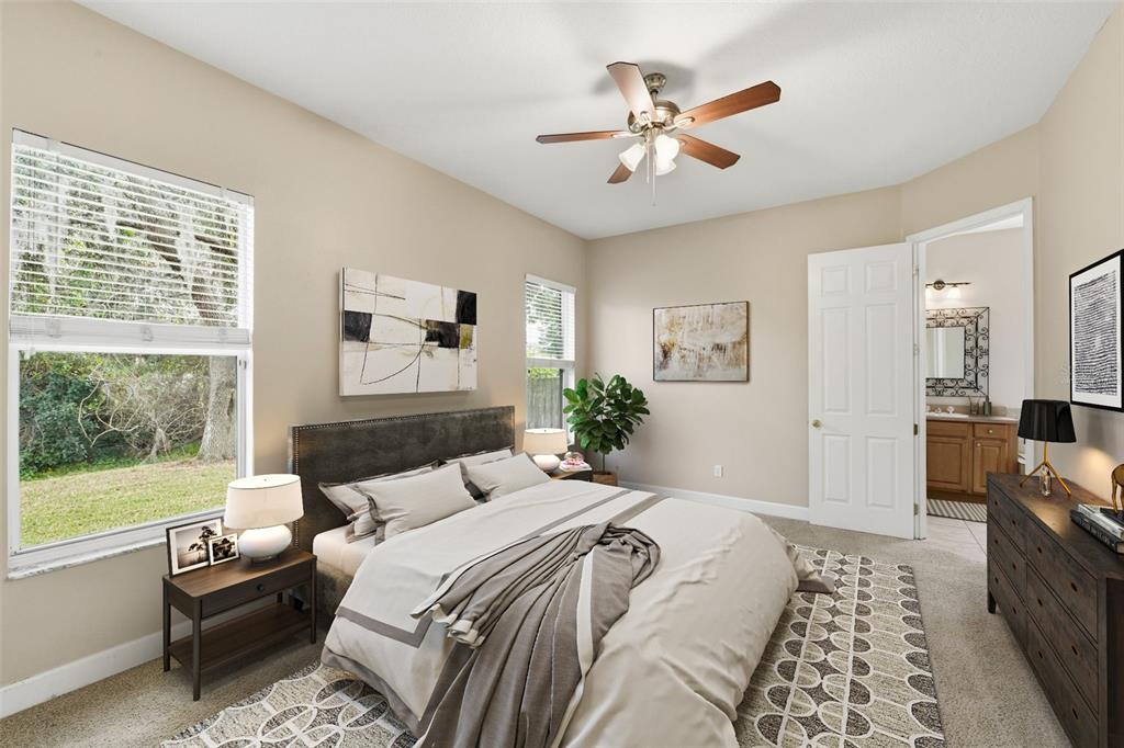 609 Renner Road Port Orange, FL 32127 - Photo 14 of 37 a bedroom with a large bed and a window