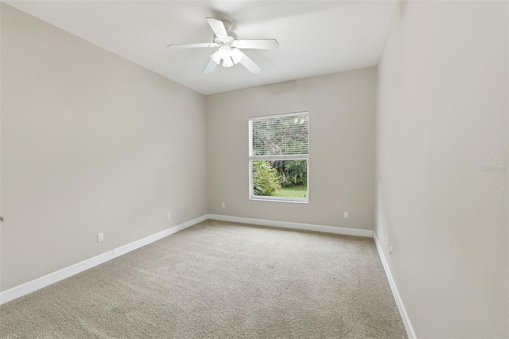 609 Renner Road Port Orange, FL 32127 - Photo 20 of 37 an empty room with windows and fan