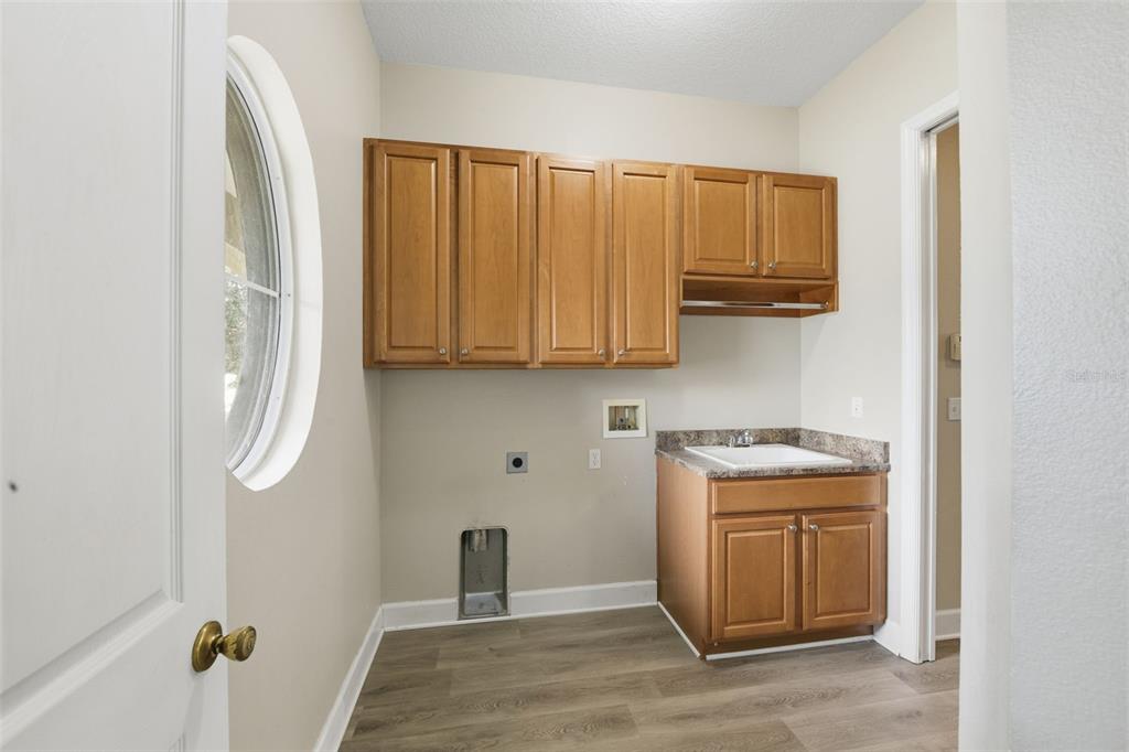 609 Renner Road Port Orange, FL 32127 - Photo 29 of 37 a kitchen with stainless steel appliances granite countertop a refrigerator and a sink