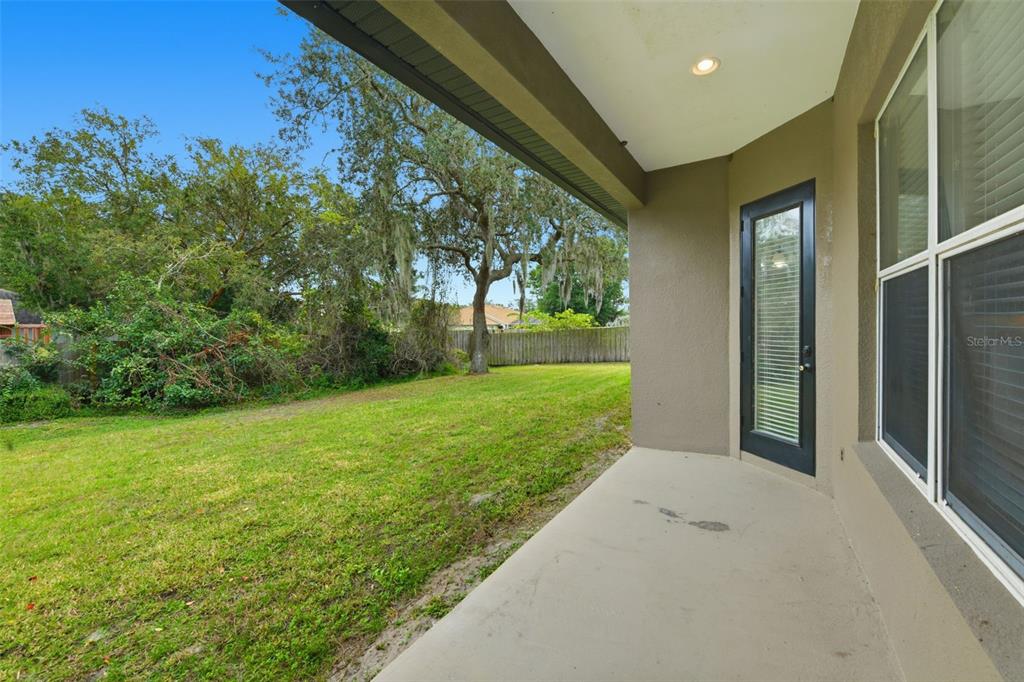 609 Renner Road Port Orange, FL 32127 - Photo 31 of 37 a view of a big room with a big yard and potted plants