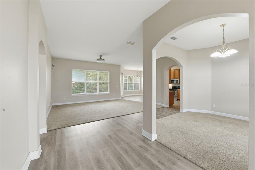 609 Renner Road Port Orange, FL 32127 - Photo 7 of 37 a view of an empty room with window and wooden floor